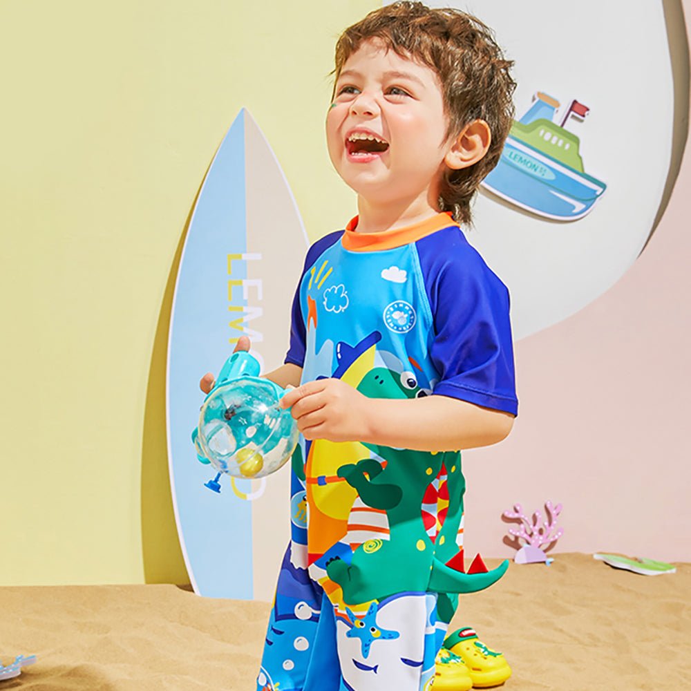 Blue Surfing Dino Printed Kids Knee Length UPF 50+ Swimwear With Free Washbag